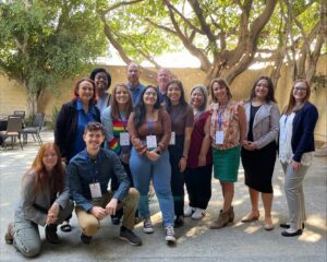 2022 Blueprint Conference_NV FSI Picture on 1st Day A large group poses for a picture in a well lit courtyard