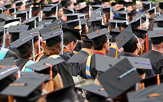 Large group of graduates with caps.