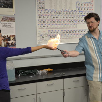 A professor demonstrates chemistry