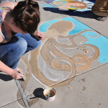 A students decorates the Western Nevada College campus in Carson City, Nev