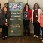Foster Youth Ambassador Laura Obrist poses for a photo with other conference attendees before a banner that reads 'Blueprint for Success Conference'