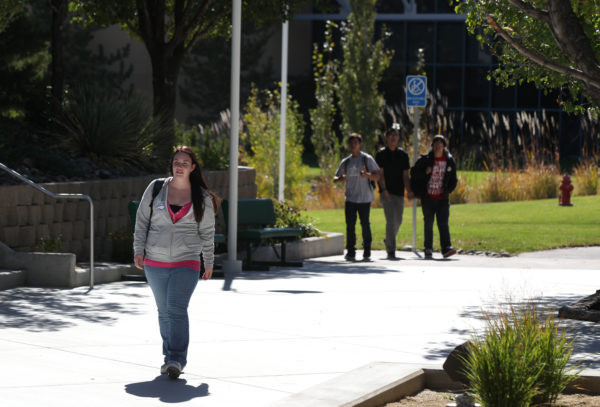 A student walks across the Western Nevada College campus