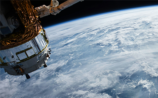 Space perspective of the Earth accompanied by a floating Satellite.
